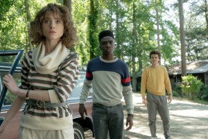 STRANGER THINGS. (L to R) Natalia Dyer as Nancy Wheeler, Caleb McLaughlin as Lucas Sinclair and Joe Keery as Steve Harrington in STRANGER THINGS. Cr. Tina Rowden/Netflix © 2022