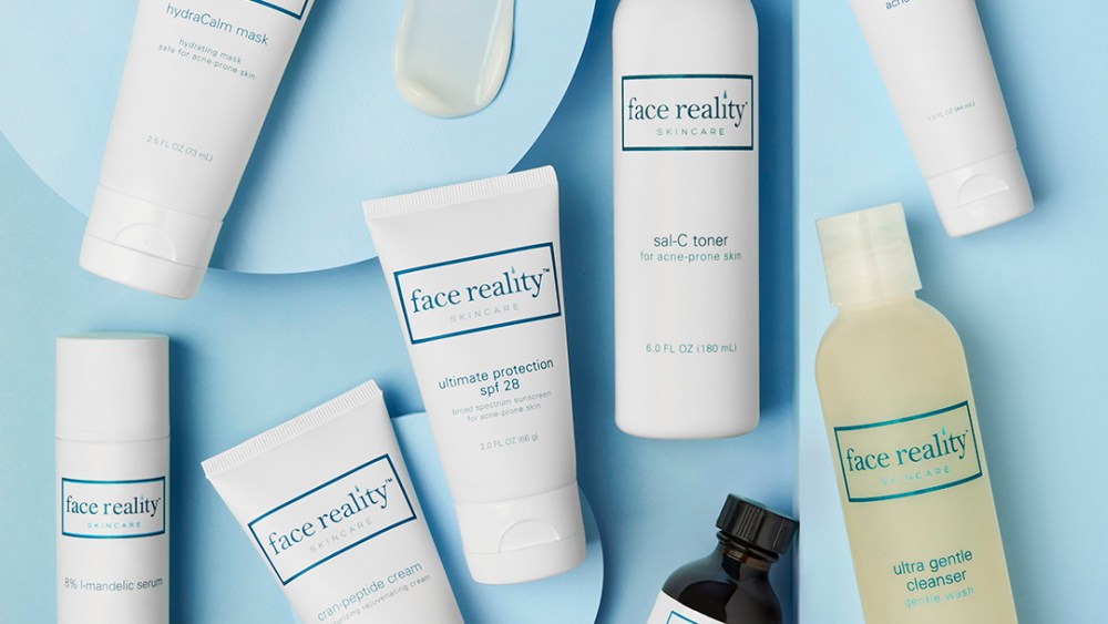 A variety of Face Reality products shot from above with a blue background behind them.