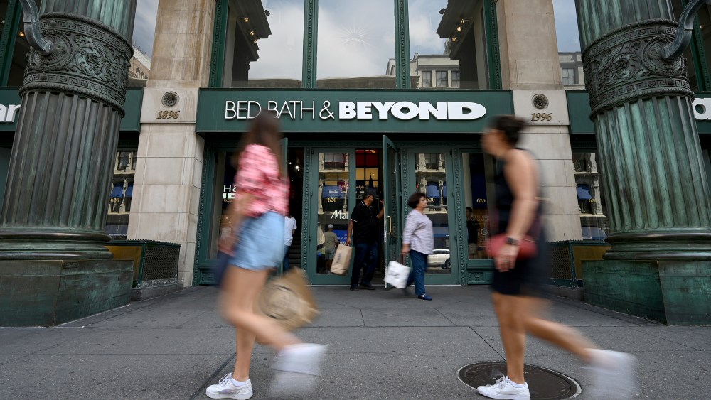 People walk by an entrance to a Bed Bath & Beyond retail store along Sixth Avenue in New York, NY, September 4, 2022. The home goods retailer Bed Bath & Beyond announced that it will close 150 stores and cut 20% of its labor force due to weak sales and high inventory supplies. (Photo by Anthony Behar/Sipa USA)(Sipa via AP Images)