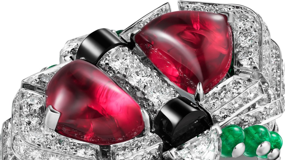Cartier’s Beautés du Monde high jewelry ring in white gold, two cabochon-cut rubies, two half- moon-shaped diamonds, triangular-shaped emeralds, emerald beads, onyx, and brilliant-cut diamonds.
