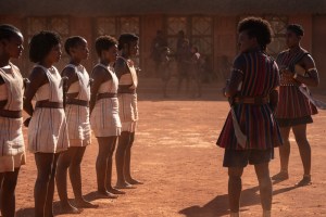 Viola Davis and Lashana Lynch with young recruits in THE WOMAN KING.