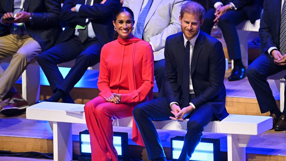 Britain's Meghan, Duchess of Sussex and Britain's Prince Harry, Duke of Sussex, react as they attend the annual One Young World Summit at Bridgewater Hall in Manchester, north-west England on September 5, 2022. - The One Young World Summit is a global forum for young leaders, bringing together young people from over 190 countries around the world to come together to confront the biggest challenges facing humanity. (Photo by Oli SCARFF / AFP) (Photo by OLI SCARFF/AFP via Getty Images)