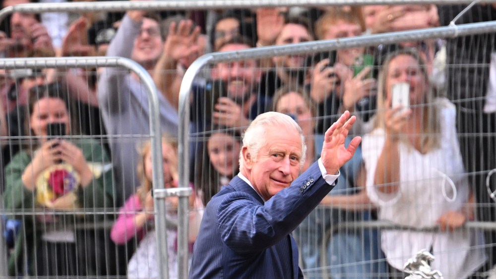 King Charles III greets members of the crowd along the Mall in London during an impromptu walkabout following the death of Queen Elizabeth II.