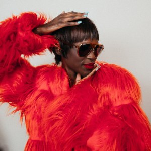 Updated Aviator: Ray-Ban’s acetate sunglasses. Anna Sui acrylic, polyester and modacrylic coat.
