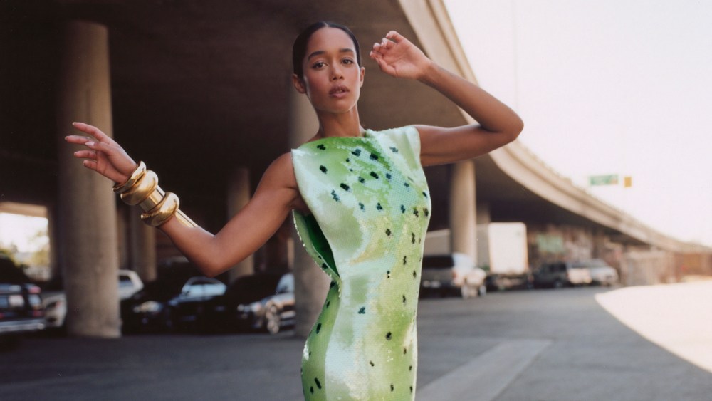 Bottega Veneta’s printed sequined dress and leather boots. Alexis Bittar gold bangles.
