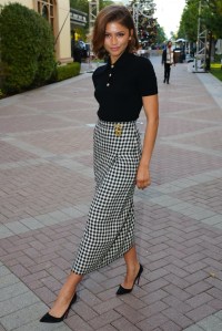 Zendaya, Schiaparelli, skirt, plaid skirt, polo, polo shirt, button up shirt, Euphoria, FYC, Christian Louboutin, So Kate pumps, pumps, heels, high heels, black pumps, pointed toe pumps, suede pumps, stiletto pumps, stilettos, red soles