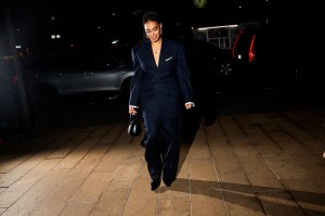 Solange walking with cars behind her