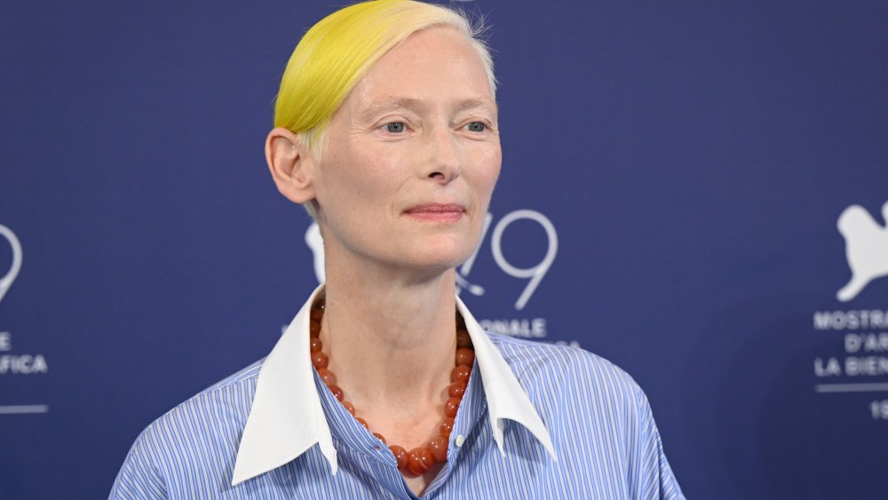 VENICE, ITALY - SEPT. 6:  Tilda Swinton with yellow hair for ukraine flag colors attends the photocall for "The Eternal Daughter" at the 79th Venice International Film Festival on September 06, 2022 in Venice, Italy. (Photo by Stephane Cardinale - Corbis/Corbis via Getty Images)