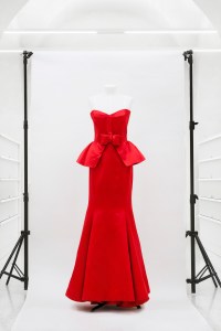 A red strapless gown with peplum bodice and fit and flare skirt from Valentino's Prêt-À-Porter Fall-Winter 1987-88, mod 372.