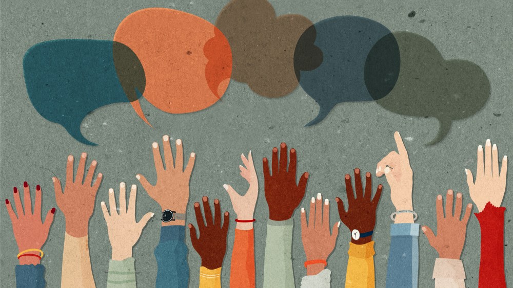 Anonymous arms and raised hands of multiethnic multicultural group people.Speech bubble. Crowd diversity people. Man and women of diverse races. Communication. Racial equality.
