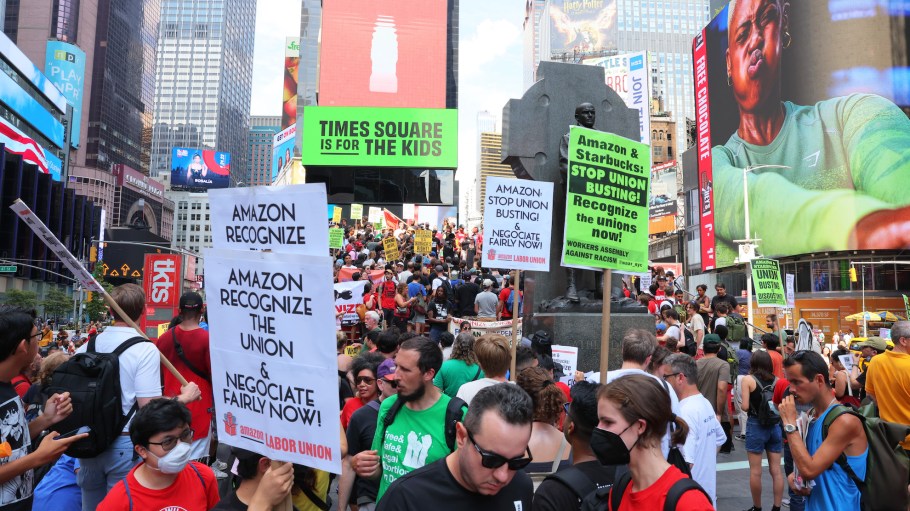 Pro-union protestors hold a rally at Times Square on September 05, 2022 in New York City. Members of the Amazon Labor Union (ALU) led by Christian Smalls, President of the ALU, and Amazon workers were joined by Starbucks workers, community organizations and pro-union protestors for a Labor Day March for Recognition demanding their unions be recognized by Amazon and Starbucks.