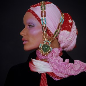 Veruschka Von Lehndorff wears convertible sautoir-bracelets in gold with emeralds, rubies, amethysts, turquoises, citrines and diamonds, ca. 1969 from BVLGARI Heritage Collection.