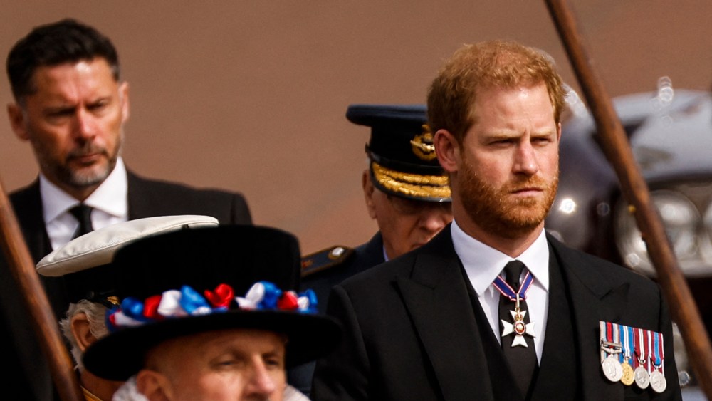 Britain's Prince Harry, Duke of Sussex follows the coffin of Queen Elizabeth II, draped in the Royal Standard, as it travels on the State Gun Carriage of the Royal Navy, from Westminster Abbey to Wellington Arch in London on September 19, 2022, after the State Funeral Service of Britain's Queen Elizabeth II. (Photo by Odd ANDERSEN / AFP) (Photo by ODD ANDERSEN/AFP via Getty Images)