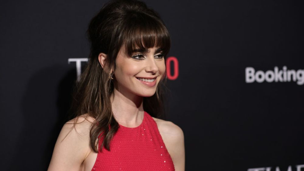 NEW YORK, NEW YORK - OCTOBER 25: Lily Collins red ralph lauren dress attends the Time100 Next at Second on October 25, 2022 in New York City. (Photo by Jamie McCarthy/Getty Images)