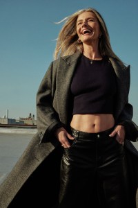 Lafayette 148’s wool coat over Gauchere’s cotton and elastane tank top and Helmut Lang’s leather pants. Givenchy pumps; Balenciaga earrings; Miansai necklace; Christian Dior ring; Joanna Laura ring.