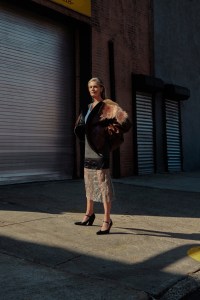 Prada’s leather and shearling jacket, cotton tank top, cloth and mesh skirt and shoes. Balenciaga earrings; Miansai necklace.