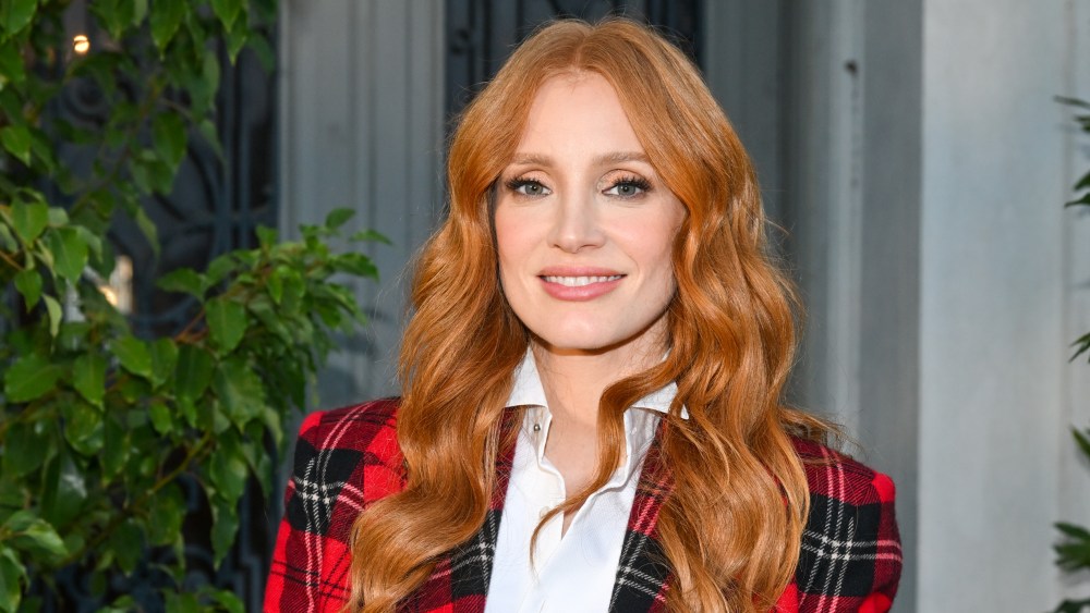 Jessica Chastain in red plaid jacket at the Ralph Lauren spring 2023 runway show held at The Huntington Museum and Gardens on Oct. 13 in San Marino, Calif.