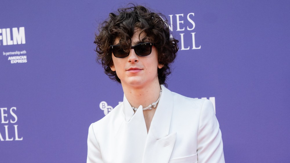 Timothée Chalamet in white Alexander McQueen suit attends the "Bones and All" premiere during the 66th BFI London Film Festival at the Royal Festival Hall on Oct. 8 in London, England.
