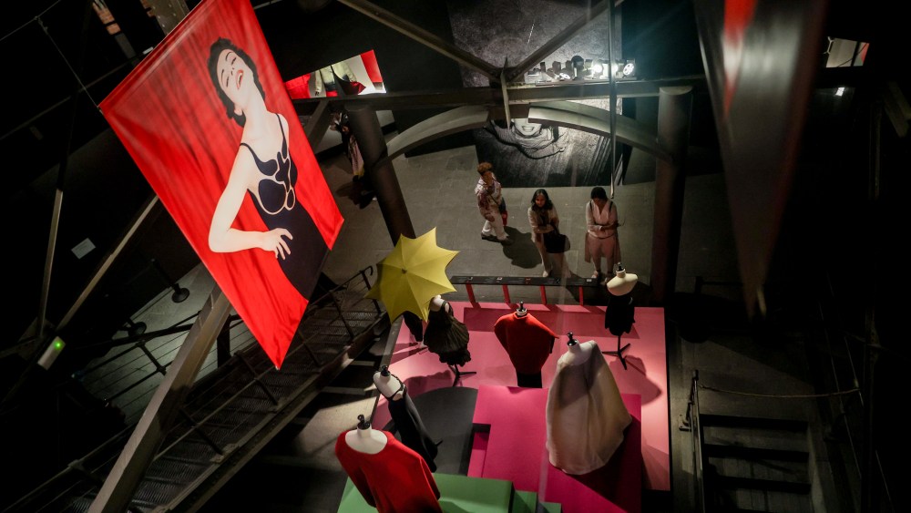 MADRID, SPAIN - OCTOBER 16: Several people look at some of the designs that make up the exhibition 'Sybilla. El hilo invisible', at La Sala Canal de Isabel II, on 16 October, 2022 in Madrid, Spain. This is the largest exhibition dedicated to the Spanish designer Sybilla, who travels through the different creative states through which she has passed in her 40-year career. Considered by many the main creator of Spanish fashion since Cristobal Balenciaga, Sybilla has evolved her chromatic range, the fabrics chosen and the technique of the garments, to reach a complexity and mastery that elevate her to the category of the great couturieres of the History of Fashion. (Photo By Ricardo Rubio/Europa Press via Getty Images)