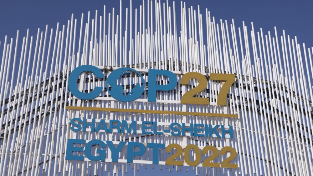 SHARM EL SHEIKH, EGYPT - NOVEMBER 07: A sign hangs over the main entrance on day two of the UNFCCC COP27 climate conference on November 07, 2022 in Sharm El Sheikh, Egypt. The conference is bringing together political leaders and representatives from 190 countries to discuss climate-related topics including climate change adaptation, climate finance, decarbonisation, agriculture and biodiversity. The conference is running from November 6-18. (Photo by Sean Gallup/Getty Images)