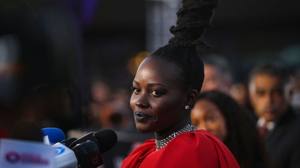 MEXICO CITY, MEXICO - NOVEMBER 09: Lupita Nyong’o speaks with the media during the Wakanda Forever Red Carpet in Mexico City at Plaza Satelite on November 09, 2022 in Mexico City, Mexico. (Photo by Agustin Cuevas/Getty Images for Disney)