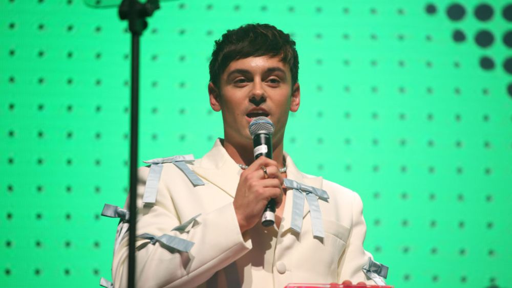 LONDON, ENGLAND - NOVEMBER 25: Tom Daley receives the 'Changemaker' award onstage during the GAY TIMES Honours Awards 2022 held at Magazine London on November 25, 2022 in London, England. (Photo by Lia Toby/Getty Images for GAY TIMES)
