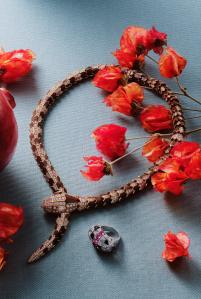 Bulgari’s High Jewelry Serpenti necklace in pink gold and snakewood elements with two pear brilliant-cut diamonds and pavé diamonds and Cartier’s Beautés du Monde High Jewelry ring, 18-karat white gold, rubellites, onyx and diamonds.