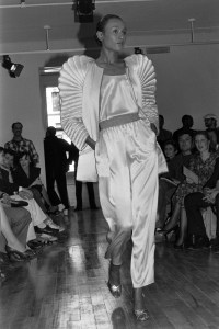 Model Aria in a silk satin quilted puff sleeve jacket over a tank and pants during the Fernando Sanchez Fall 1983 Loungewear collection. The fashion took place at the Sanchez's new loft space in New York on May 10, 1983.