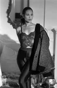 Beverly Johnson in a lace bralette top, shiny leggings and velvet quilted jacket from the Fernando Sanchez Fall 1987 Loungewear collection.