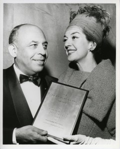 Rosalind Russell receiving the Neiman Marcus Fashion Award from Stanley Marcus.