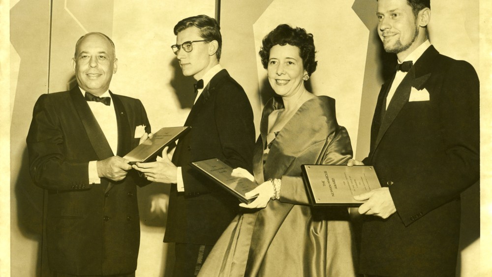 Stanley Marcus, Yves Saint Laurent, Helen Lee and Jens Quistgaard at the Neiman Marcus Fashion Award Ceremony, 1958.
