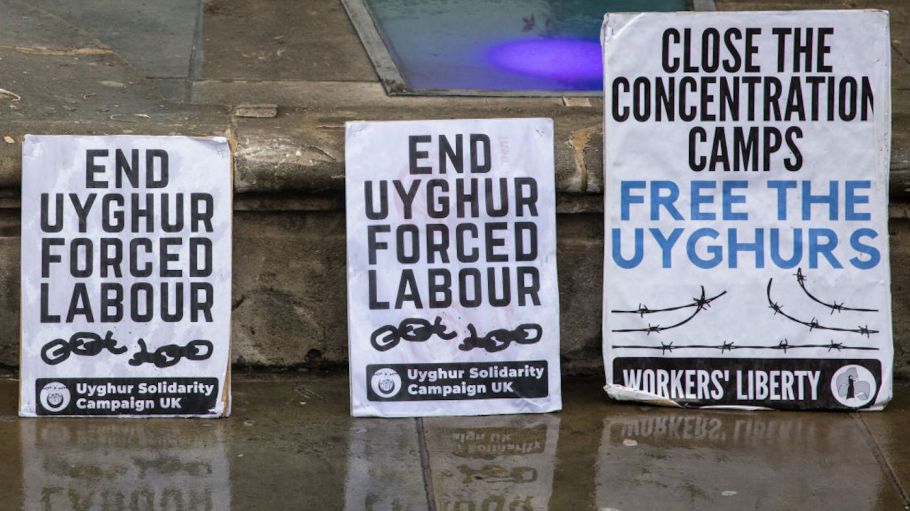 Uyghur Solidarity Campaign UK placards are pictured at a protest opposite the Chinese embassy