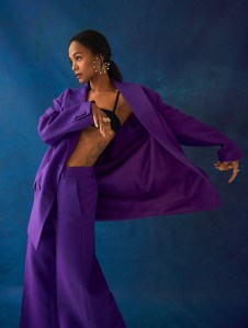 Valentino’s crepe couture blazer and pants over LaQuan Smith’s wool blend bra. Boucheron Serpent Bohème Solarité multi-motif hoop earrings, set with round diamonds, on yellow gold; Vendorafa 18-karat yellow gold dome ring; Bulgari Serpenti Viper ring in 18k yellow gold with diamonds and B.zero1 Rock ring in 18k yellow gold with diamonds; David Yurman ring in 18k yellow gold with pavé diamonds; Anita Ko gold ring; Delfina Delettrez 18k gold, white diamond and akoya pearl ring; Hamilton Jewelers 18k rose gold ring.