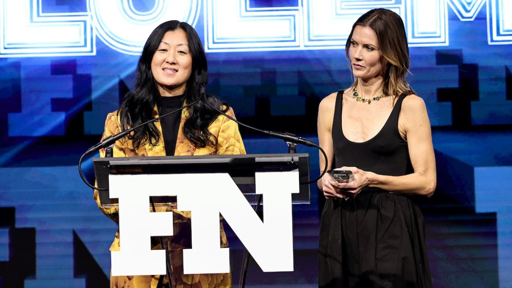 NEW YORK, NEW YORK - NOVEMBER 30: Sun Choe and Nikki Neuburger accept an award during the 2022 Footwear News Achievement Awards at Cipriani South Street on November 30, 2022 in New York City. (Photo by Jamie McCarthy/Footwear News via Getty Images)