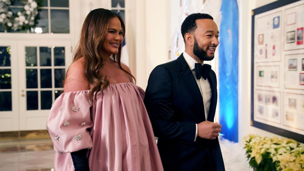 WASHINGTON, DC - DECEMBER 01:  John Legend and Chrissy Teigen arrive for the White House state dinner for French President Emmanuel Macron at the White House on December 1, 2022 in Washington, DC. The official state visit is the first of the Biden administration.  (Photo by Nathan Howard/Getty Images)
