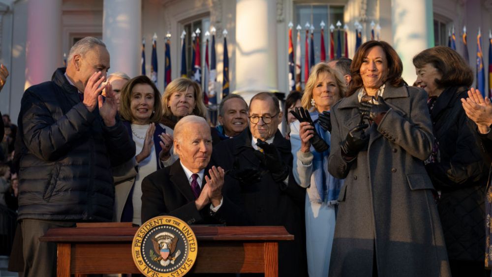 WASHINGTON, DC - DECEMBER 13: U.S. President Joe Biden applauds after signing the Respect for Marriage Act as rainbow lights lit up on the South Lawn of the White House December 13, 2022 in Washington, DC. The Respect for Marriage Act will codify same-sex and interracial marriages. (Photo by Drew Angerer/Getty Images)