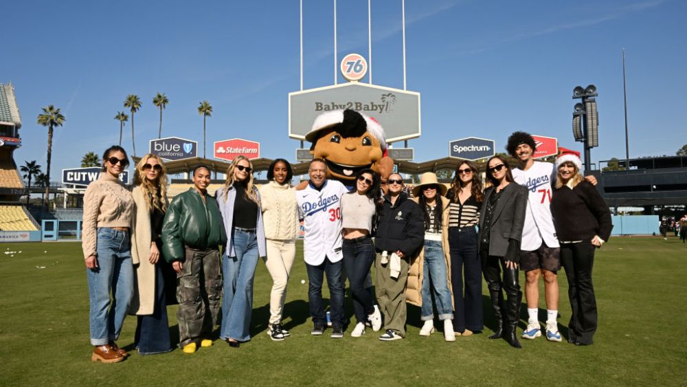 LOS ANGELES, CALIFORNIA - DECEMBER 14: (L-R) Jordana Brewster, Rachel Zoe, Lori Harvey, Baby2Baby Co-CEO Kelly Sawyer Patricof, Kelly Rowland, Dodgers Manager Dave Roberts, Lauren Sánchez, Jennifer Meyer, Ali Wong, Baby2Baby Co-CEO Norah Weinstein, Chriselle Lim, Dodger Miguel Vargas, and Julie Bowen attend The Baby2Baby Holiday Distribution presented by FRAME and Nordstrom at Dodger Stadium on December 14, 2022 in Los Angeles, California. (Photo by Michael Kovac/Getty Images for Baby2Baby)
