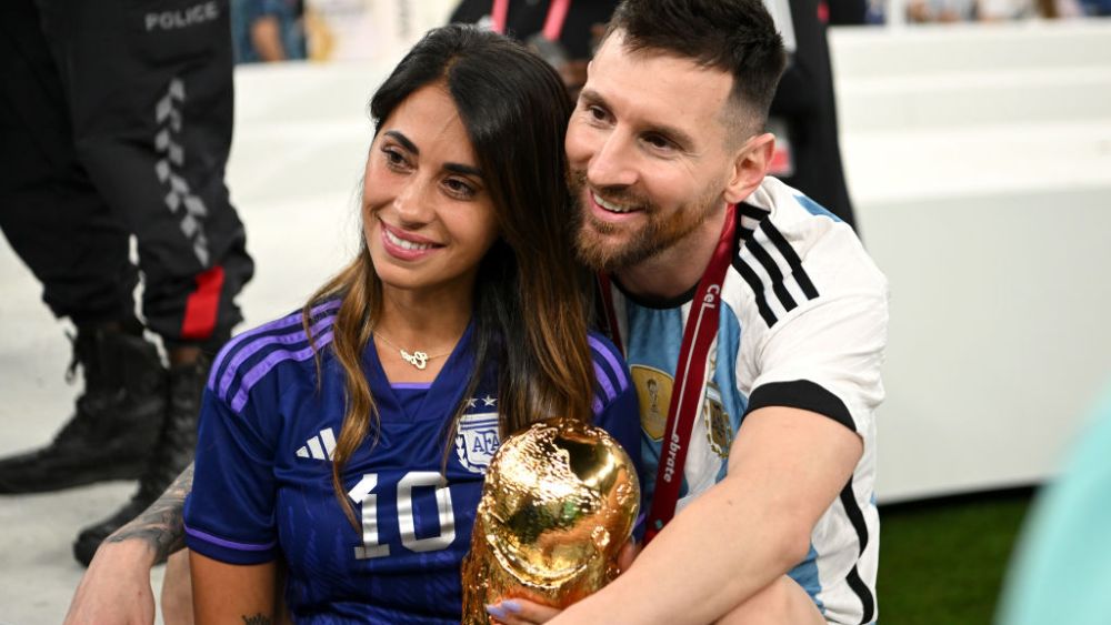 LUSAIL CITY, QATAR - DECEMBER 18: Lionel Messi of Argentina celebrates with his wife Antonela Roccuzzo and the FIFA World Cup Qatar 2022 Winner's Trophy following the FIFA World Cup Qatar 2022 Final match between Argentina and France at Lusail Stadium on December 18, 2022 in Lusail City, Qatar. (Photo by Shaun Botterill - FIFA/FIFA via Getty Images)