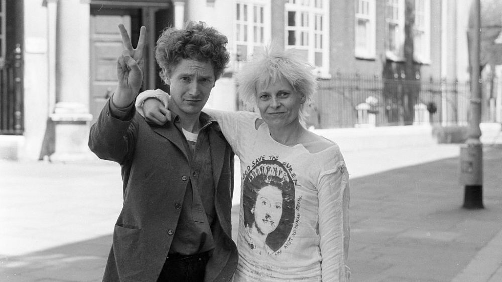 Punk rock group "Sex Pistols" manager Malcolm McLaren and friend designer Vivienne Westwood seen here outside Bow Street Magistrate Court, after being remanded on bail for fighting. (Photo by Daily Mirror / Bill Kennedy/Mirrorpix/Mirrorpix via Getty Images)