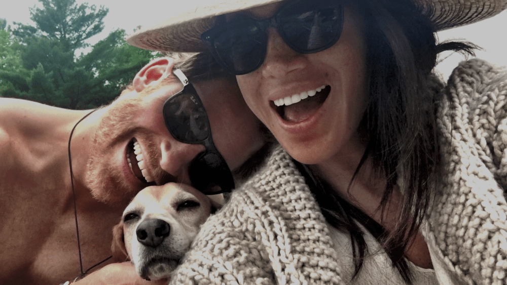 Prince Harry and Meghan Markle in a picture with their dog in Netflix's Harry & Meghan.