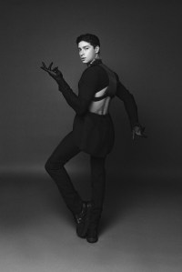 Alexander McQueen’s wool suit. Alexander McQueen harness and necklace; Jil Sander boots.