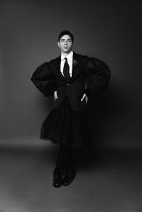 Simone Rocha’s wool jacket and pants, cotton shirt and elasticated layered tutu. Thom Browne shoes; Pamela Love twisted sterling silver hoop earrings; RJ Graziano pin.