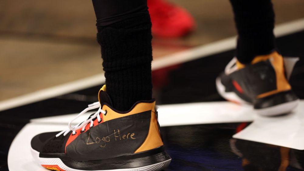 Former Nike spokesman Kyrie Irving blacked out the Nike logo on his shoes after being released from his endorsement deal by the shoe company on Dec. 5.