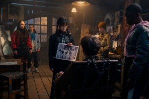 Wednesday. (L to R) Naomi j Ogawa as Yoko Tanaka, Oliver Watson as Kent, Jenna Ortega as Wednesday Addams, Hunter Doohan as Tyler Galpin, Georgie Farmer as Ajax Petropolus, Joy Sunday as Bianca Barclay in episode 108 of Wednesday. Cr. Vlad Cioplea/Netflix © 2022