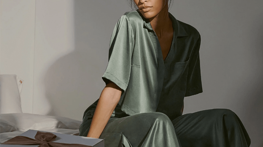 woman in silk pajama set to combat dry winter dkin