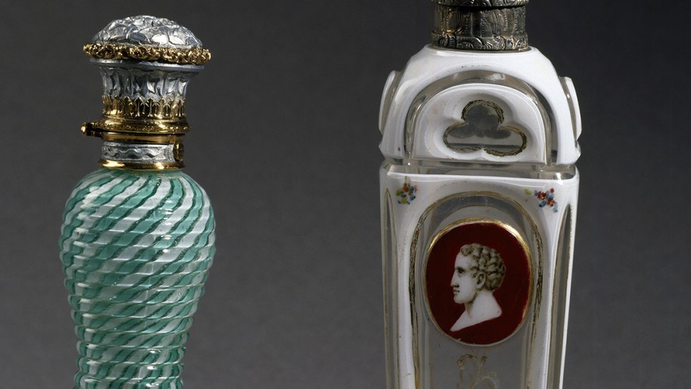 Perfume Bottles Throughout History, 19th Century, FRANCE - SEPTEMBER 25: Perfume bottle in filigree milk glass on the left, manufactured by Clichy, on the right Dwerlay glass from Charles X period. France, 19th century. Paris, Mus√©e De La Parfumerie Fragonard (Perfume Museum). (Photo by DeAgostini/Getty Images)