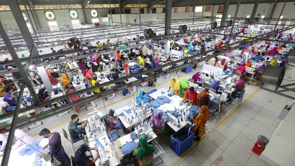 Garment employees work at Arrival Fashion Ltd. in Gazipur, Bangladesh, Saturday, March 13, 2021. The owner of this business, Shafiqul Islam, was studying business at Dhaka College in 1971 when a bloody and brutal war for independence ravaged Bangladesh. After undergoing guerrilla training in India, he returned to fight against Pakistani soldiers. Fifty years on, his factory employs nearly 3,000 workers who make jeans for export to Europe and North America. (AP Photo/Mahmud Hossain Opu)