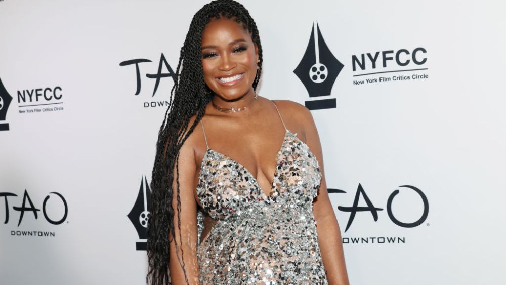pregnant Keke Palmer in silver michael kors collection dress shows her baby bump on red carpet at the 2023 New York Film Critics Circle Awards on Jan. 4 in New York City.