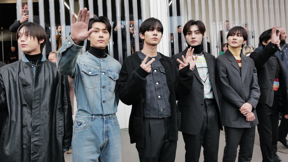 Enhypen band members are seen arriving at the Prada fashion show on January 15, 2023 in Milan, Italy.