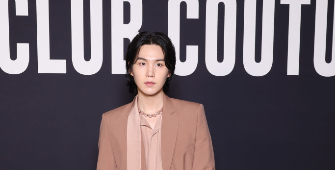 PARIS, FRANCE - JANUARY 25: (EDITORIAL USE ONLY - For Non-Editorial use please seek approval from Fashion House) Suga attends the Valentino Haute Couture Spring Summer 2023 show as part of Paris Fashion Week  on January 25, 2023 in Paris, France. (Photo by Pascal Le Segretain/Getty Images)